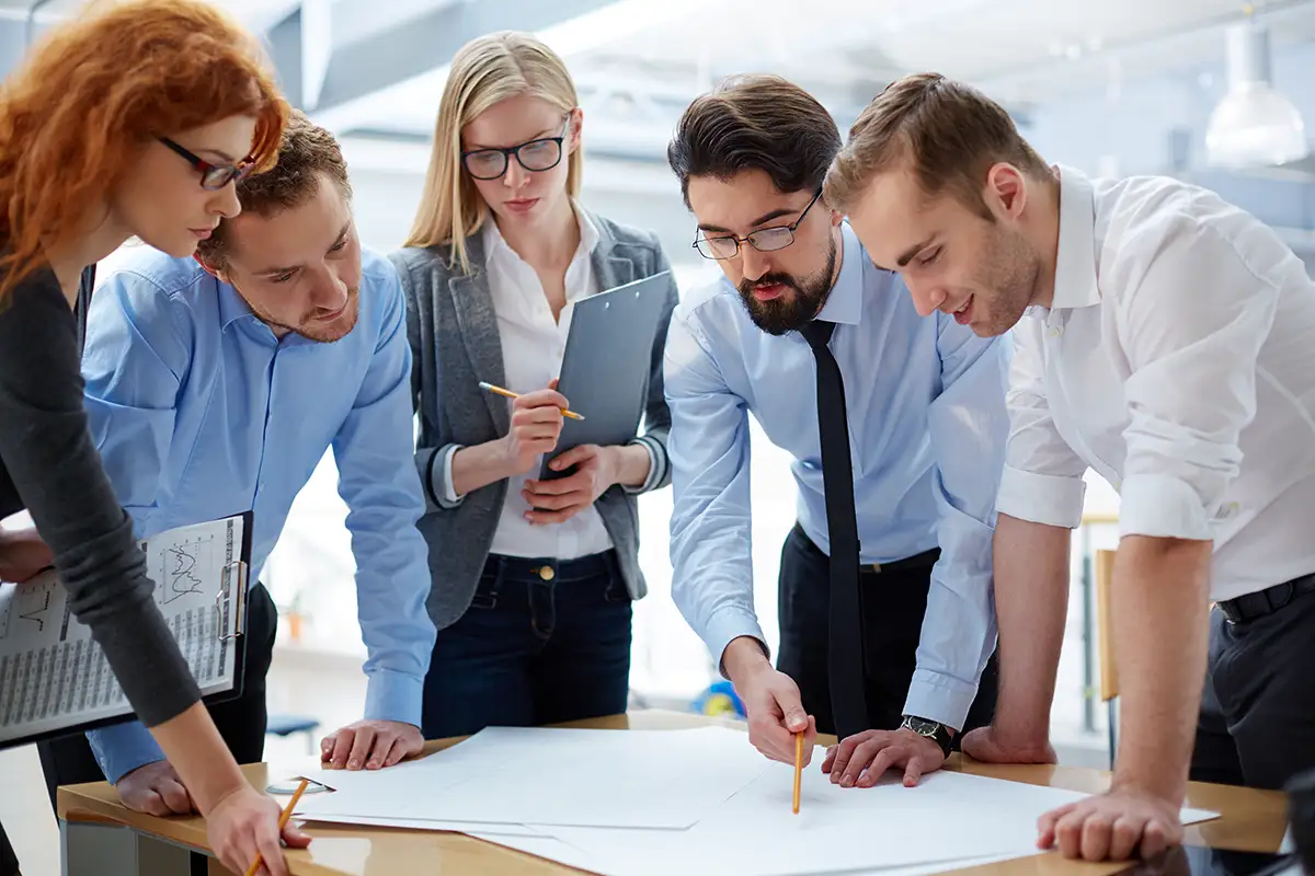 business-team-collaborating-on-project-in-office business-team-collaborating-on-project-in-office